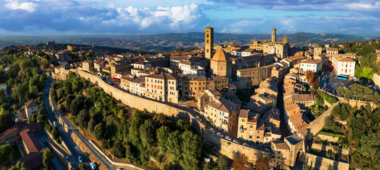 Sticker - Italy. Volterra - scenic medieval town of Tuscany, Italian famous landmarks and heritage site. aerial drone panorama over sunset.