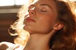 Woman sunlit profile emphasizes hair texture and skin glow. Natural beauty in sunlight.