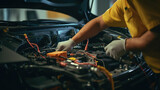 Fototapeta Tulipany - A technician is checking the electrical system inside a car