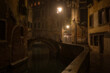 Houses along the canal and the bridge in Venice in night