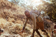 © Marko Geber - Young African American hiker climbing natural terrain