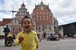Kid playing traveling in Riga, letonia

