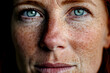 Close up photo of freckled face of middle aged ginger haired woman without makeup