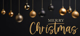 Fototapeta  - Merry Christmas, festive celebration holiday holidays greeting card with text - Hanging gold black ornaments ( christmas baubles balls ) on black wall texture background