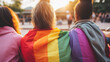 © Thumbs - group of young diverse people lgbtq+ activists holding the lgbt pride rainbow flag, generative ai