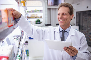 Wall Mural - Handsome pharmacist working