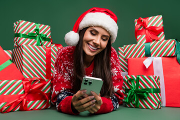 Wall Mural - Closeup photo of smile young lady iphone advertisement app store games season sale eshop stack gifts isolated on green color background