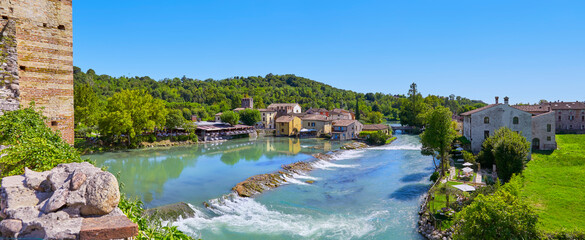 Poster - Beautiful panoramic view of the mill village of Borghetto in the south of Lake Garda, in Veneto, Italy.