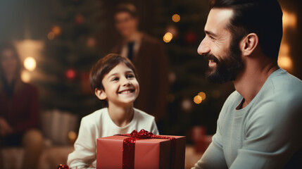 Wall Mural - Happy father's day! Child congratulating dad and giving him gift box.