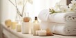 © AkimD - AI Generated. AI Generative. Aroma spa relaxing beauty concept with white clean towels and cosmetic bottles decoration background. Graphic Art