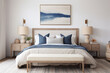 amplio dormitorio con cama, banqueta y  ropa de cama en tonos azules y grises, junto a dos mesitas de madera y cuadro abstracto en pared