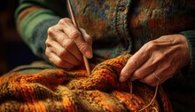 A Grandmother's Hand Knitting, With Colorful Yarn And Needles 