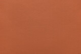 Fototapeta Zwierzęta - Genuine orange leather, eco friendly leatherette texture background. Material for upholstery and interior design, sport items and clothes. Wallpaper, banner, backdrop.