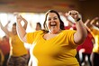 © Justlight - A woman with obesity leads a fitness class, her energy and enthusiasm inspiring others to push themselves to their limits. As a fitness instructor, she has found joy and fulfillment in helping