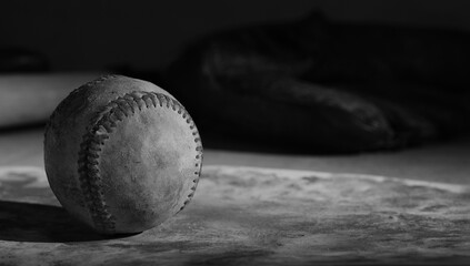 Canvas Print - Baseball used in game shows old grunge texture in black and white with copy space on background.