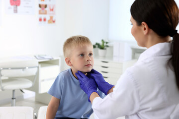 Sticker - Endocrinologist examining boy's thyroid gland at hospital