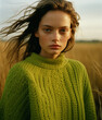 Beautiful young woman in green knitwear sweater.