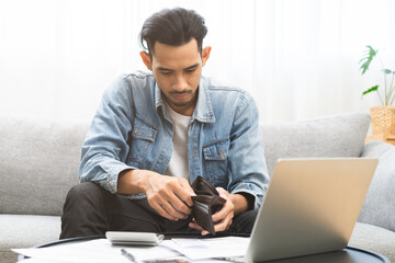 Wall Mural - Debt financial concept, stressed problem people asian man, male hand open empty wallet not have budget of money to pay no have credit card, not able payment bill, loan or expense with bank, bankruptcy