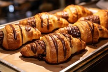 Chocolate croissants in bakery.
