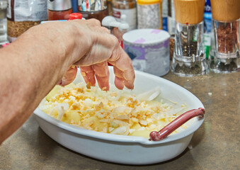 Canvas Print - Glass dish with potatoes, egg and onion