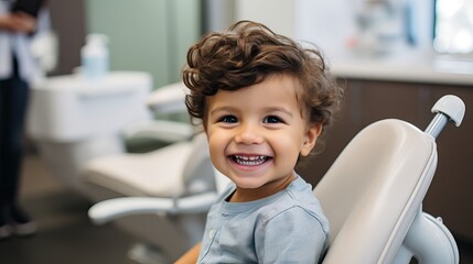 Wall Mural - Cute young boy visiting dentist, having his teeth checked by female dentist in dental office