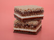 Delicious chocolate wafers with hazelnuts on a pink background. Wafers with chocolate and nuts.