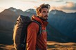 © Rudsaphon - Handsome young man with backpack hiking in the mountains at sunset