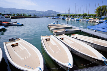 Wall Mural - Harbor with leisure moored boats at town promenade.