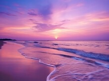 Summer Beach With Blue Water And Purple Sky At The Sunset.