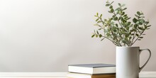 White Ceramic Mug, Stack Of Books And Eucalyptus Branch On White Wooden Table, Space For Text