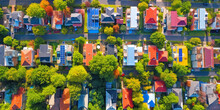 Family Colorful Houses In Neighborhood With Green Trees, Aerial View Of Sustainable Settlement