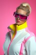 © Glittering Humanity - A stunning woman embraces the snowy season with confidence, donning a fashionable pink and yellow ski goggles as she glides down the slopes, her jacket and sunglasses adding a touch of winter cool