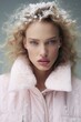 © Glittering Humanity - A captivating winter goddess adorned in fashionable attire, her youthful face dusted with delicate snow, exudes an ethereal beauty as she gazes into the camera with a fierce determination