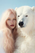© Glittering Humanity - In the midst of a winter wonderland, a stunning woman with flowing locks stands gracefully alongside a majestic white wolf, exuding an untamed yet elegant energy as she poses in the snowy landscape