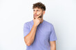 © luismolinero - Young handsome caucasian man isolated on white background having doubts