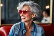 elegace stylish old senior woman red sun glasses enjoy travel lifestyle happiness cheerful positive smile in cafe coffeeshop restaurant daylight