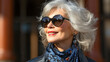 © Ignacio Ferrándiz - Elegant ederly woman with sunglasses smiling on the city street