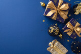 Fototapeta Mapy - Frosty Holiday Gift Inspiration. Top view shot of sparkling blue and gold gift boxes, balls with 