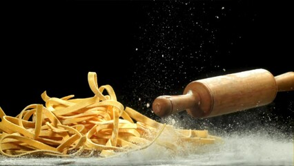 Sticker - The rolling pin falls on the table with flour. Filmed on a high-speed camera at 1000 fps. High quality FullHD footage