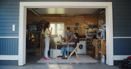 Poster - Diverse Team Of Three Young Startup Company Founders Working In Retro Garage, Using Old Desktop Computer. Male And Female Entrepreneurs Developing Innovative Fintech Service In Nostalgic nineties.