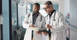 © N Felix/peopleimages.com - Doctors, teamwork and advice with documents, hospital folder and patient charts for healthcare planning or solution. Professional men with file, digital tablet and medical information or clinic data