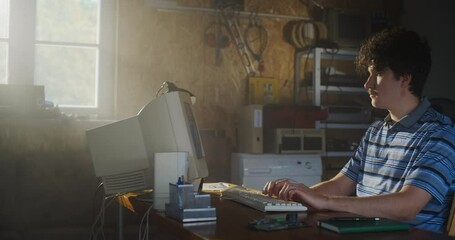 Fototapete - Caucasian Male Software Engineer Programming On Old Desktop Computer In Retro Garage. Enthusiast Browsing Early Internet Forums, Coding Applications, Chatting Online In Nineties. Nostalgia Concept.