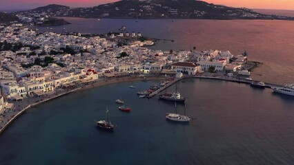 Wall Mural - Mykonos town of famous greek island, Aegean sea, Cyclades, Greece. Harbor sunset