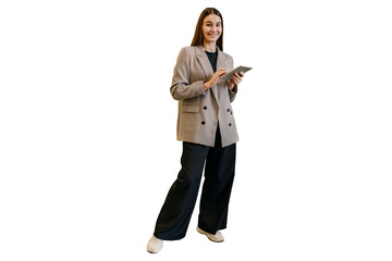 A full-length woman in office clothes uses a tablet in her hands. A young student smiles using a device.  Transparent background.