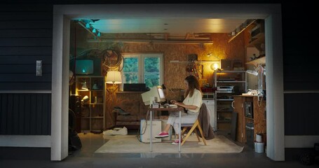 Fototapete - Hispanic Female Software Engineer Programming on Old Desktop Computer In Retro Garage In The Evening. Focused Woman Starting Tech Startup Company In Nineties. Coding Innovative Online Service At Home.
