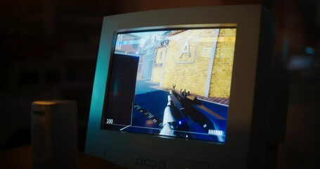 Poster - Close Up Of Old Desktop Computer With 3D First-Person Shooter Video Game In Retro Garage Late At Night In Nineties. Dated PC Of Gamer Running Popular Game With Character Playing Against Enemies.