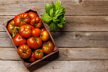 Wall Mural - Assorted tomatoes in rustic crate