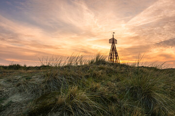 Wall Mural - Denmark's oldest seamark at sunset