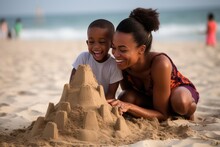 Family, Mother And Child Enjoying A Sunny Day On The Beach, Building Sand Castles.