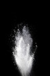 White powder explosion on black background. Colored cloud. Color dust explode. Paint Holi.